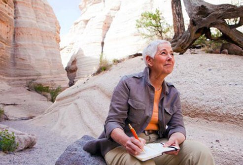 Photo of woman writing.