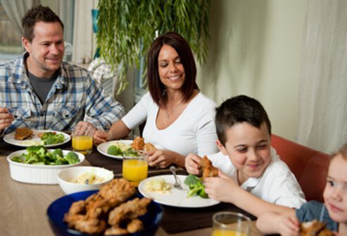 Prepare plates for meals in the kitchen, not at the table.