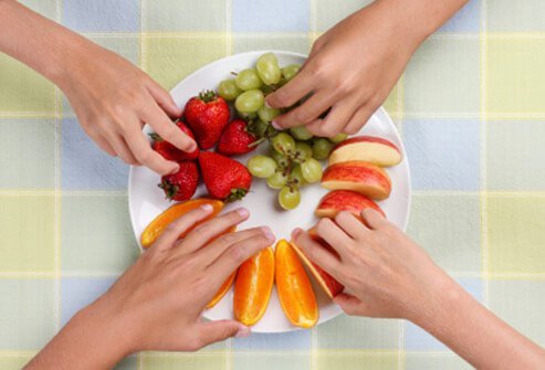 Prepare plates in the kitchen to teach children correct portion sizes.	