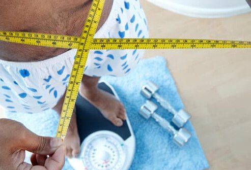 Photo of man on scale.