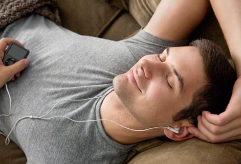 Photo of man listening to music.