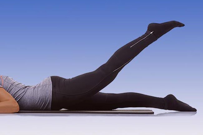 Lie on your stomach with your legs straight.