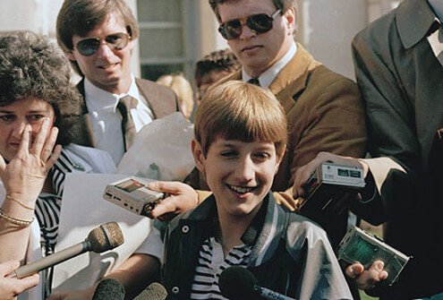 AIDS victim Ryan White surrounded by reporters.
