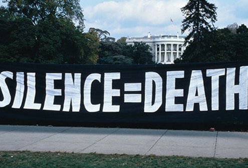 ACT UP activists protest US AIDS policy with Silence=Death motto.