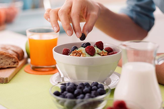 Sift 2 teaspoons of matcha into half a cup of Greek yogurt and mix it up.