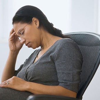 Woman feeling weak, tired, and fatigued.