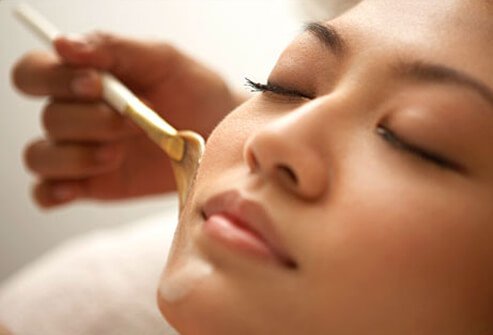 Photo of a woman having a facial.