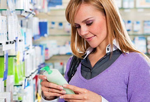 Photo of a woman shopping for lotion.