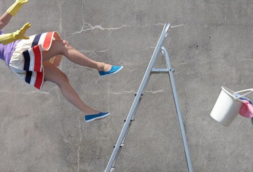 Woman falling off of a ladder.