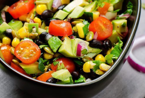 Get all the flavor of a taco salad without the extra calories by topping it with black beans and avocado.