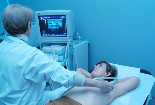 During a breast MRI the breasts are exposed as the patient lies flat on a padded platform with cushioned openings for the breasts.