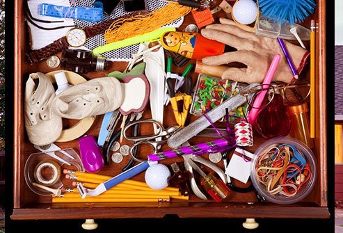 It's home to all kinds of random things: batteries, birthday candles, stray buttons and tacks, change from various countries, stamps, tools, take-out menus, receipts, SIM cards, stamps, flash drives, and rubber bands.