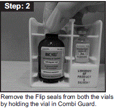 Remove the Flip seals from both the vials by holding the
vial in Combi Guard - Illustration Remove the Flip seals from both the vials by holding the
vial in Combi Guard - Illustration