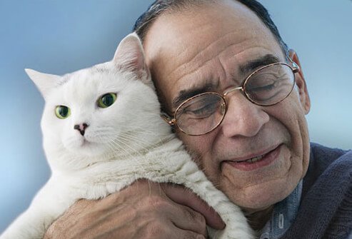Photo of an older man with his cat.