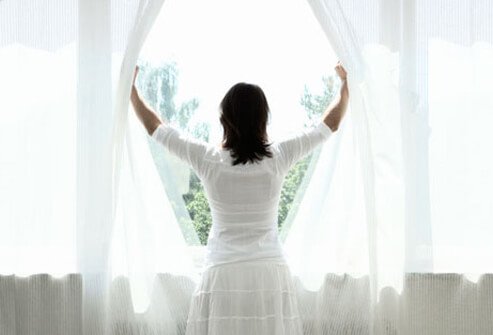 A woman trying to get enough sunlight.