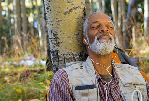 A guy finding time fpr himself listening to some music.