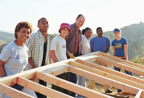 A group of people building a home.