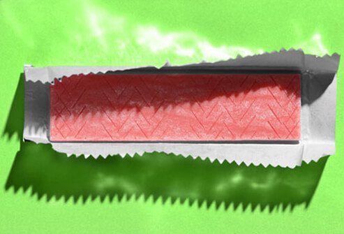 A photo of a stick of chewing gum in foil.
