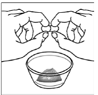 Hold each end of the
SUSTIVA capsule between your thumbs and index (pointer)
fingers - Illustration
