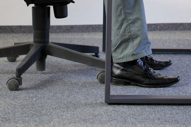 Always make sure your feet are on the floor for good office ergonomics.