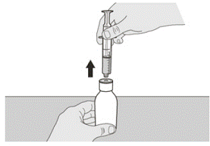 Remove the oral syringe from the bottle
adapter by gently pulling straight up on the oral
syringe while holding the plunger in place - Illustration