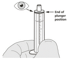 Push the plunger of the oral syringe all the way
down to remove any air in the oral syringe - Illustration