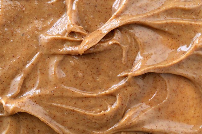 Almond butter is a good substitute for peanut butter and you can even make your own with a blender.