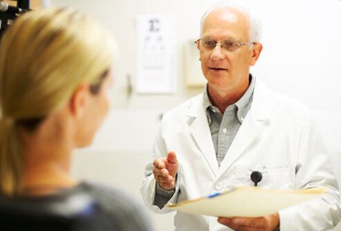 Photo of doctor talking to woman.