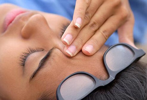 Photo of woman with headache.