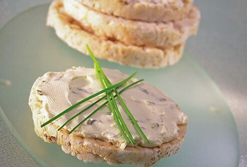 Rice cakes with spread herbs.