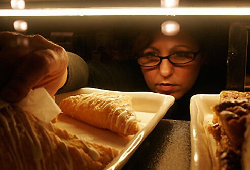 Photo of woman reaching for sugary treat.