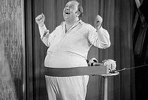 Photo of overweight man in fad belt massager.