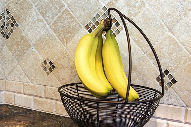Keep bananas on a banana hanger until they ripen, then you can place them in the fridge for a few days.