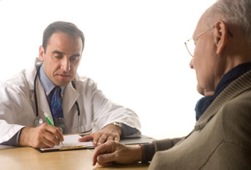 Doctor discussing hyperthyroidism treatment with a patient.