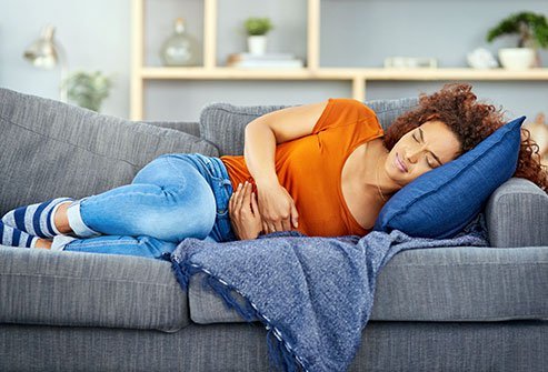 Woman experienceing stomach pain