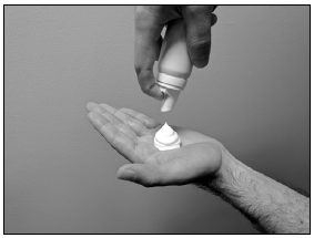 Press down on the actuator to dispense a small amount of the foam into the palm of your hand - Illustration Press down on the actuator to dispense a small amount of the foam into the palm of your hand - Illustration