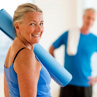 A woman does yoga to help her back.
