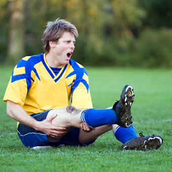 A soccer player suffers a leg muscle cramp.