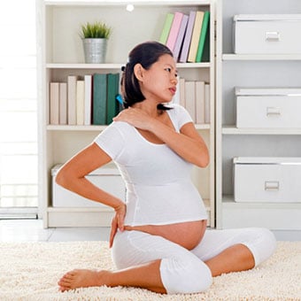 A pregnant woman experiences neck cramps and lower back pain.