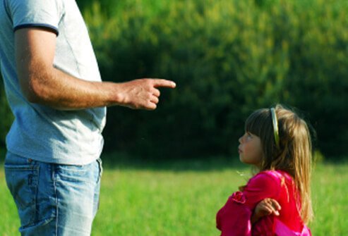 A father explains the rules to his daughter.