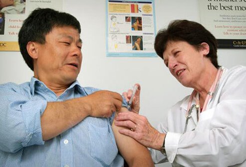 A man getting vaccinated for whooping cough.