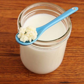 Kefir in a jar with a spoon