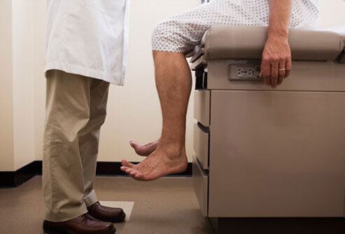 Photo of man on exam table, about to be screened for prostate cancer.