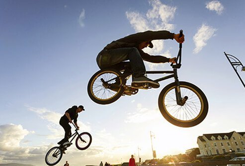 Photo of two people motocross racing.