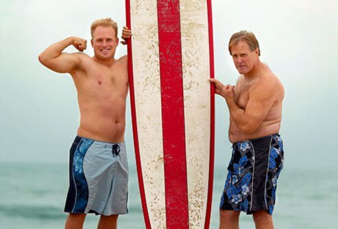 A senior man and younger man at the beach.