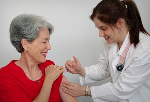 A woman receives the shingles vaccine.