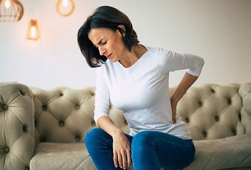 Lower back pain is the most common symptom of spondylolisthesis.