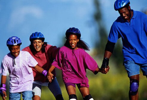 Photo of a family rollerblading.