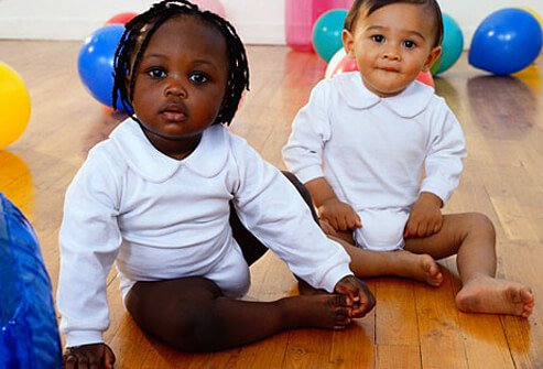 Toddler having fun playing with friends