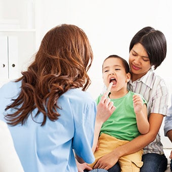 A child is evaluated to see if a tonsillectomy or adenoidectomy surgery is needed.